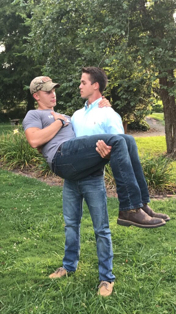Image of Joseph holding Jake Chappell in his arms